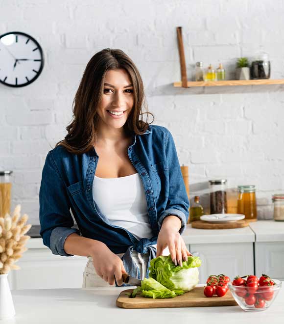 Single lady cooking in her kitchen